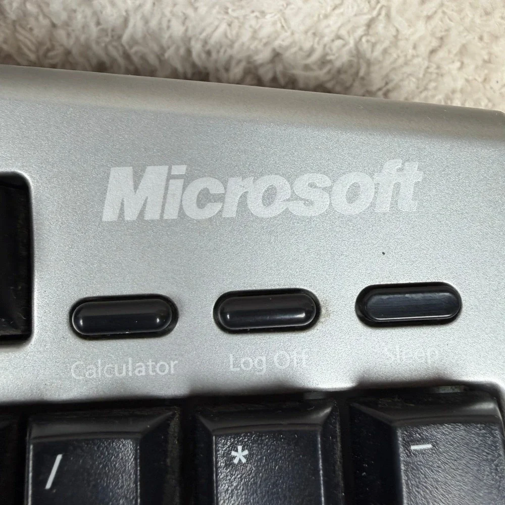 Microsoft Wireless Comfort Keyboard 4000 Ergonomic USB Model 1045 Silver Black‎
